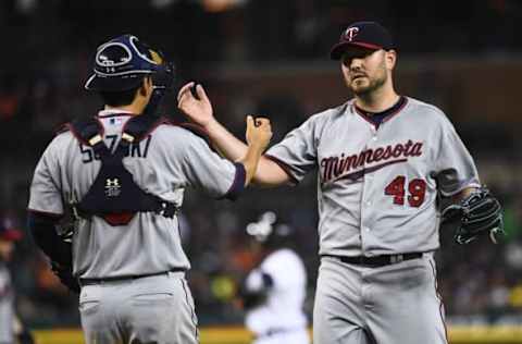 Sep 26, 2015; Detroit, MI, USA; Minnesota Twins catcher Kurt Suzuki (8) and relief pitcher Kevin Jepsen (49) celebrate their win over the Detroit Tigers at Comerica Park. Mandatory Credit: Tim Fuller-USA TODAY Sports