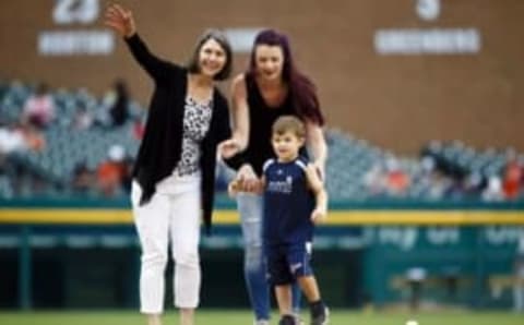 Jun 28, 2016; Detroit, MI, USA; Widow of former Detroit Tigers pitcher Mark Fidrych, her daughter Jessica and grandson David deliver the game ball prior to the game against the Miami Marlins at Comerica Park. Mandatory Credit: Rick Osentoski-USA TODAY Sports