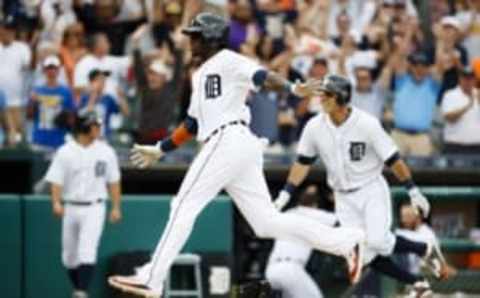 Jun 23, 2016; Detroit, MI, USA; Detroit Tigers Cameron Maybin (4) scores the winning run on a wild pitch by Seattle Mariners relief pitcher Steve Cishek (not pictured) in the 10th inning at Comerica Park. Detroit won 5-4. in ten innings. Mandatory Credit: Rick Osentoski-USA TODAY Sports