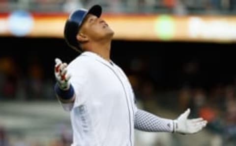 Jul 15, 2016; Detroit, MI, USA; Detroit Tigers first baseman Miguel Cabrera (24) reacts to a catch by Kansas City Royals right fielder Brett Eibner (not pictured) at the right field wall designing him a home run in the third inning at Comerica Park. Mandatory Credit: Rick Osentoski-USA TODAY Sports