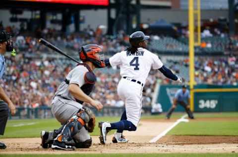 Jul 29, 2016; Detroit, MI, USA; Detroit Tigers center fielder Cameron Maybin (4) hits a single in the first inning against the Houston Astros at Comerica Park. Mandatory Credit: Rick Osentoski-USA TODAY Sports