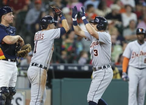 Apr 17, 2016; Houston, TX, USA; Detroit Tigers second baseman Ian Kinsler (3) celebrates with shortstop Jose Iglesias (1) after hitting a home run against the Houston Astros during the fifth inning at Minute Maid Park. Mandatory Credit: Troy Taormina-USA TODAY Sports