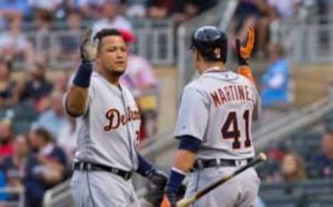 Aug 24, 2016; Minneapolis, MN, USA; Detroit Tigers first baseman Miguel Cabrera (24) celebrates with designated hitter Victor Martinez (41) after hitting a home run in the first inning against the Minnesota Twins at Target Field. Mandatory Credit: Brad Rempel-USA TODAY Sports