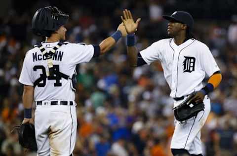 Aug 26, 2016; Detroit, MI, USA; Detroit Tigers catcher James McCann (34) and center fielder Cameron Maybin (4) celebrate after the game against the Los Angeles Angels at Comerica Park. Detroit won 4-2. Mandatory Credit: Rick Osentoski-USA TODAY Sports