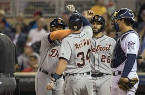 Sep 20, 2016; Minneapolis, MN, USA; Detroit Tigers designated hitter James McCann (34) celebrates with left fielder Justin Upton (left) and right fielder J.D. Martinez (28) after hitting a three run home run in the sixth inning against the Minnesota Twins at Target Field. Mandatory Credit: Jesse Johnson-USA TODAY Sports