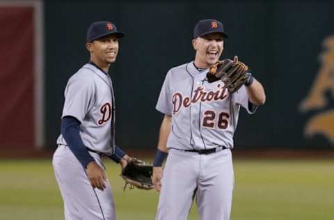 May 26, 2015; Oakland, CA, USA; Detroit Tigers shortstop Dixon Machado (49) and second baseman Hernan Perez (26) react after defeating the Oakland Athletics 1-0 at O.co Coliseum. Mandatory Credit: Ed Szczepanski-USA TODAY Sports