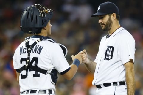 Sep 18, 2015; Detroit, MI, USA; Detroit Tigers starting pitcher Justin Verlander (35) fist bumps with catcher James McCann (34) just before being relieved in the ninth inning against the Kansas City Royals at Comerica Park. Mandatory Credit: Rick Osentoski-USA TODAY Sports