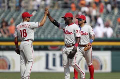 May 25, 2016; Detroit, MI, USA; Philadelphia Phillies center fielder Odubel Herrera (37) celebrates with second baseman Cesar Hernandez (16) and shortstop Freddy Galvis (13) after the game against the Detroit Tigers at Comerica Park. Phillies win 8-5. Mandatory Credit: Raj Mehta-USA TODAY Sports