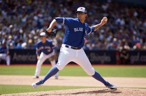 Jul 10, 2016; Toronto, Ontario, CAN; Toronto Blue Jays relief pitcher Brett Cecil (27) throws a pitch during the eighth inning in a game against the Detroit Tigers at Rogers Centre. The Toronto Blue Jays won 6-1. Mandatory Credit: Nick Turchiaro-USA TODAY Sports