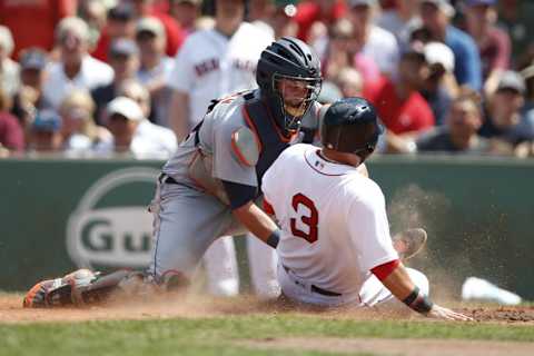 Jul 27, 2016; Boston, MA, USA; Detroit Tigers catcher James McCann (34) applies to the tag to Boston Red Sox catcher Sandy Leon (3) during the third inning at Fenway Park. Mandatory Credit: Greg M. Cooper-USA TODAY Sports