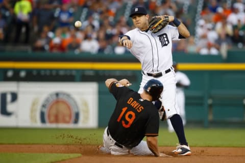 Sep 9, 2016; Detroit, MI, USA; Detroit Tigers second baseman Ian Kinsler (3) makes a throw to first to complete a double play as Baltimore Orioles first baseman Chris Davis (19) slides into second in the second inning at Comerica Park. Mandatory Credit: Rick Osentoski-USA TODAY Sports