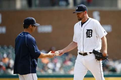 Sep 15, 2016; Detroit, MI, USA; Detroit Tigers manager Brad Ausmus (7) takes the ball to relieve starting pitcher Mike Pelfrey (37) in the second inning against the Minnesota Twins at Comerica Park. Mandatory Credit: Rick Osentoski-USA TODAY Sports