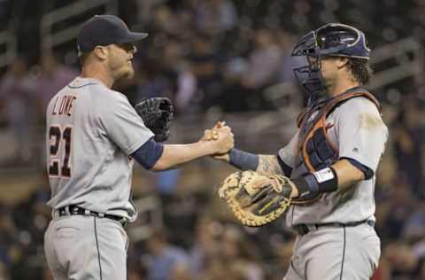 Sep 20, 2016; Minneapolis, MN, USA; Detroit Tigers relief pitcher Mark Lowe (21) celebrates with catcher Jarrod Saltalamacchia (39) after defeating the Minnesota Twins at Target Field. The Tigers won 8-1. Mandatory Credit: Jesse Johnson-USA TODAY Sports