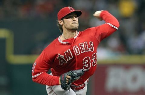 Jul 28, 2015; Houston, TX, USA; Los Angeles Angels starting pitcher C.J. Wilson (33) pitches against the Houston Astros in the fifth inning at Minute Maid Park. Astros won 10-5. Mandatory Credit: Thomas B. Shea-USA TODAY Sports