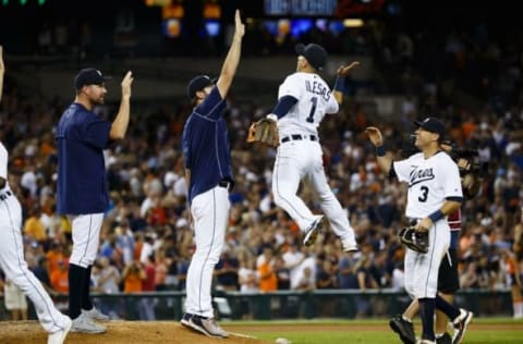 Aug 6, 2016; Detroit, MI, USA; Detroit Tigers starting pitcher Justin Verlander (35) and shortstop Jose Iglesias (1) celebrate after the game against the New York Mets at Comerica Park. Detroit won 5-6. Mandatory Credit: Rick Osentoski-USA TODAY Sports