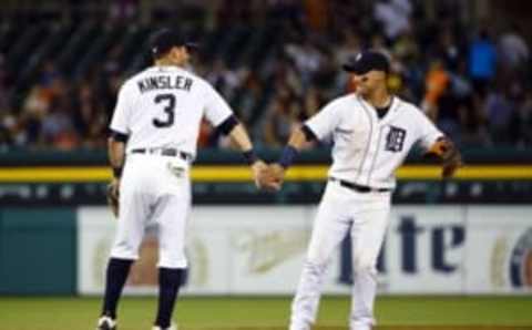 Aug 30, 2016; Detroit, MI, USA; Detroit Tigers second baseman Ian Kinsler (3) and Detroit Tigers shortstop Jose Iglesias (1) celebrate after the game against the Chicago White Sox at Comerica Park. Detroit won 8-4. Mandatory Credit: Rick Osentoski-USA TODAY Sports