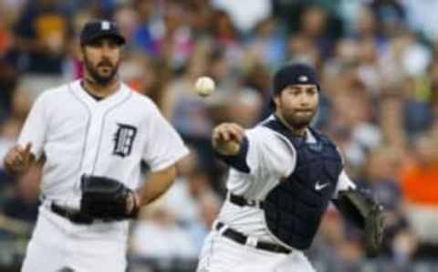 Aug 21, 2015; Detroit, MI, USA; Detroit Tigers catcher Alex Avila (13) makes a throw to first in the third inning against the Texas Rangers at Comerica Park. Mandatory Credit: Rick Osentoski-USA TODAY Sports