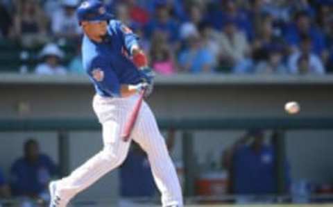 Mar 20, 2016; Mesa, AZ, USA; Chicago Cubs left fielder Juan Perez (5) hits a pitch during the fifth inning against the Kansas City Royals at Sloan Park. Mandatory Credit: Joe Camporeale-USA TODAY Sports