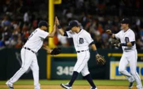 Jul 15, 2016; Detroit, MI, USA; Detroit Tigers relief pitcher Francisco Rodriguez (57) second baseman Ian Kinsler (3) and third baseman Andrew Romine (17) at Comerica Park. Mandatory Credit: Rick Osentoski-USA TODAY Sports