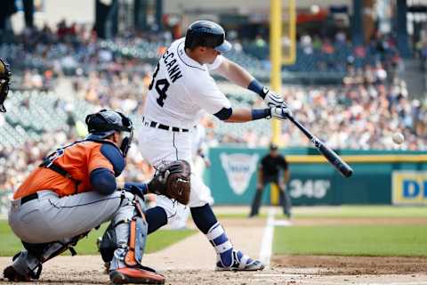 Jul 31, 2016; Detroit, MI, USA; Detroit Tigers catcher James McCann (34) hits a grand slam home run in the first inning against the Houston Astros at Comerica Park. Mandatory Credit: Rick Osentoski-USA TODAY Sports