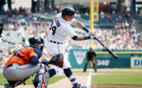 Jul 31, 2016; Detroit, MI, USA; Detroit Tigers catcher James McCann (34) hits a grand slam home run in the first inning against the Houston Astros at Comerica Park. Mandatory Credit: Rick Osentoski-USA TODAY Sports