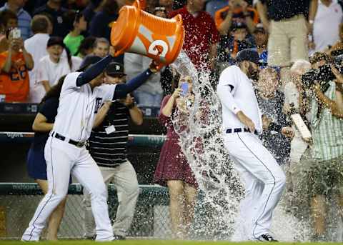 Aug 3, 2016; Detroit, MI, USA; Detroit Tigers shortstop Jose Iglesias (1) dumps water on J.D. Martinez (28) after the game against the Chicago White Sox at Comerica Park. Detroit won 2-1. Mandatory Credit: Rick Osentoski-USA TODAY Sports