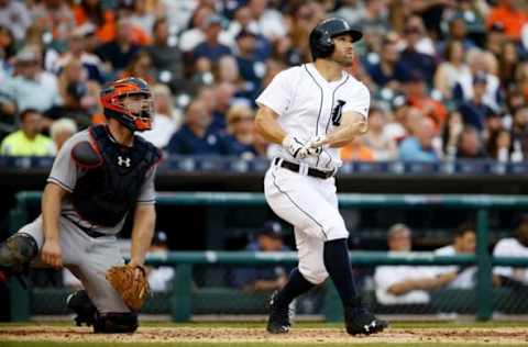 Jul 29, 2016; Detroit, MI, USA; Detroit Tigers left fielder Tyler Collins (18) hits a three run home run in the second inning against the Houston Astros at Comerica Park. Mandatory Credit: Rick Osentoski-USA TODAY Sports