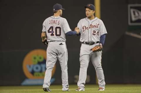 Sep 20, 2016; Minneapolis, MN, USA; Detroit Tigers third baseman JaCoby Jones (40) and first baseman Miguel Cabrera (24) celebrate after defeating the Minnesota Twins at Target Field. The Tigers won 8-1. Mandatory Credit: Jesse Johnson-USA TODAY Sports