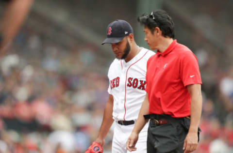 BOSTON, MA – JULY 14: Eduardo Rodriguez #57 of the Boston Red Sox leaves the game after colliding with Lourdes Gurriel Jr. #13 of the Toronto Blue Jays at the top of the sixth inning of the game at Fenway Park on July 14, 2018 in Boston, Massachusetts. (Photo by Omar Rawlings/Getty Images)