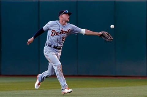 OAKLAND, CA – AUGUST 04: JaCoby Jones #21 of the Detroit Tigers is charged with an error after he is unable to field a ball hit for a single by Marcus Semien (not pictured) of the Oakland Athletics during the fourth inning at the Oakland Coliseum on August 4, 2018 in Oakland, California. Semien advanced to third base on the error. The Oakland Athletics defeated the Detroit Tigers 2-1. (Photo by Jason O. Watson/Getty Images)