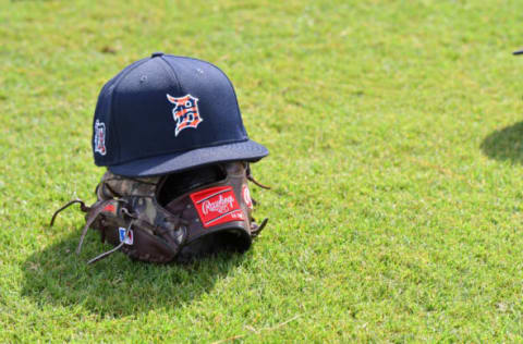 LAKELAND, FL – A detailed view of a Detroit Tigers baseball hat and Rawlings glove. (Photo by Mark Cunningham/MLB Photos via Getty Images)