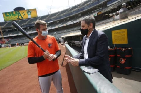 OAKLAND, CA – MAY 1: Trey Mancini #16 and Assistant General Manager Sig Mejdal of the Baltimore Orioles in the dugout before the game against the Oakland Athletics at RingCentral Coliseum on May 1, 2021 in Oakland, California. The Orioles defeated the Athletics 8-4. (Photo by Michael Zagaris/Oakland Athletics/Getty Images)