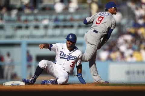 Chris Taylor is put out at second base by Javier Baez. (Photo by Meg Oliphant/Getty Images)