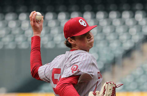 HOUSTON, TEXAS – MARCH 04: Jake Bennett #54 of the Oklahoma Sooners pitches in the first inning against the LSU Tigers during the Shriners Children’s College Classic at Minute Maid Park on March 4, 2022 in Houston, Texas. (Photo by Bob Levey/Getty Images)