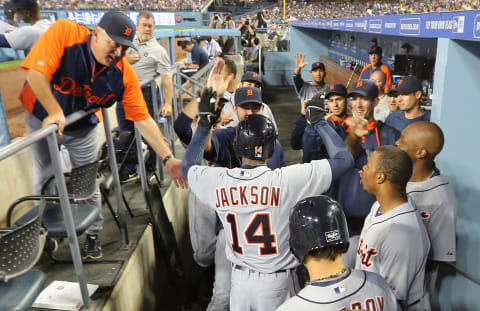 Austin Jackson celebrates with his teammates in the dugout at Dodger Stadium. (Photo by Victor Decolongon/Getty Images)