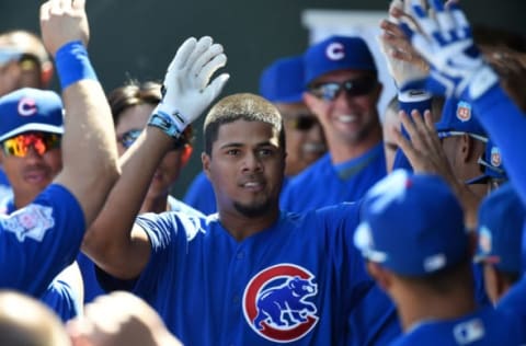 MESA, AZ – MARCH 13: Jeimer Candelario #75 of the Chicago Cubs returns to the dugout after hitting a homerun in the first inning against the Oakland Athletics on March 13, 2016 in Mesa, Arizona. (Photo by Lisa Blumenfeld/Getty Images)