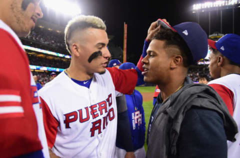 Javier Baez jokingly takes the hat off Marcus Stroman. (Photo by Harry How/Getty Images)