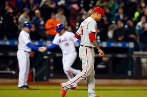 NEW YORK, NY – APRIL 19: Vince Velasquez #28 of the Philadelphia Phillies looks on as Jay Bruce #19 of the New York Mets celebrates his sixth inning three run home run with third base coach Glenn Sherlock at Citi Field on April 19, 2017 in the Flushing neighborhood of the Queens borough of New York City. (Photo by Jim McIsaac/Getty Images)