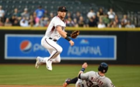 PHOENIX, AZ – MAY 10: Brandon Drury #27 of the Arizona Diamondbacks turns a double play over a sliding James McCann #34 of the Detroit Tigers at second base during the second inning at Chase Field on May 10, 2017 in Phoenix, Arizona. (Photo by Norm Hall/Getty Images)