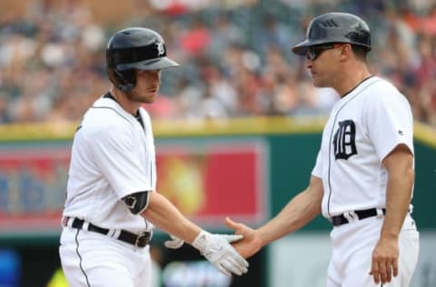 DETROIT, MI – JUNE 3: Alex Presley #14 of the Detroit Tigers singles and is congratulated by first base coach Omar Vizquel #13 during the fourth inning of the game against the Chicago White Sox on June 3, 2017 at Comerica Park in Detroit, Michigan. (Photo by Leon Halip/Getty Images)