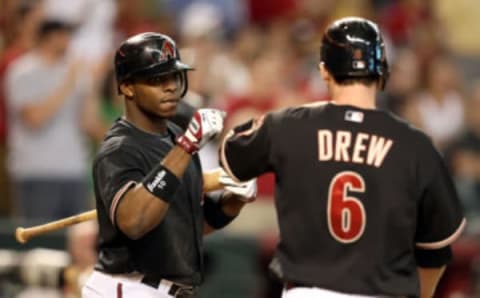 PHOENIX – AUGUST 29: Justin Upton congratulates teammate Stephen Drew after he scored a third inning run against the Houston Astros. (Photo by Christian Petersen/Getty Images)