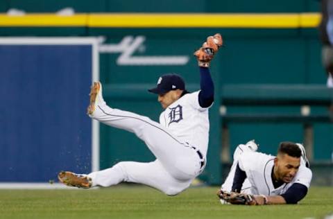 DETROIT, MI – APRIL 01: Shortstop Jose Iglesias #1 of the Detroit Tigers falls to the ground after colliding with left fielder Victor Reyes #22 of the Detroit Tigers after catching a fly ball hit by Gregory Polanco of the Pittsburgh Pirates during the fifth inning of game two of a double-header at Comerica Park on April 1, 2018 in Detroit, Michigan. (Photo by Duane Burleson/Getty Images)