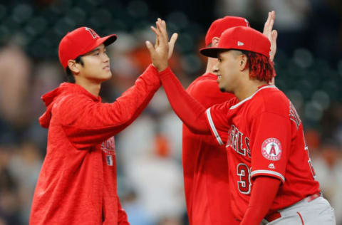 HOUSTON, TX – APRIL 23: Keynan Middleton #39 of the Los Angeles Angels of Anaheim receives a high five from Shohei Ohtani #17 after the final out against the Houston Astros at Minute Maid Park on April 23, 2018 in Houston, Texas. (Photo by Bob Levey/Getty Images)