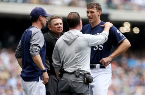 MILWAUKEE, WI – JUNE 27: Brent Suter #35 of the Milwaukee Brewers is examined after diving to field a ground ball in the fifth inning against the Kansas City Royals at Miller Park on June 27, 2018 in Milwaukee, Wisconsin. (Photo by Dylan Buell/Getty Images)