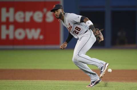 TORONTO, ON – JUNE 30: Niko Goodrum #28 of the Detroit Tigers cannot come up with an infield single hit by Devon Travis #29 of the Toronto Blue Jays in the eighth inning during MLB game action at Rogers Centre on June 30, 2018 in Toronto, Canada. (Photo by Tom Szczerbowski/Getty Images)