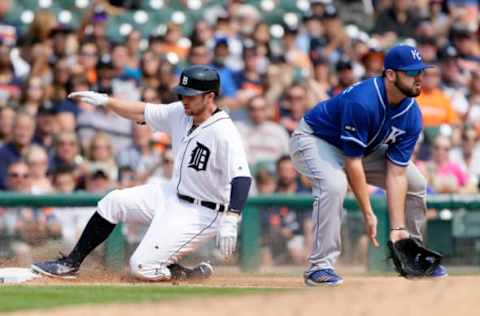 DETROIT, MI – SEPTEMBER 4: Alex Presley #14 of the Detroit Tigers slides into third base with an RBI-triple ahead of the throw to Mike Moustakas #8 of the Kansas City Royals during the fifth inning at Comerica Park on September 4, 2017 in Detroit, Michigan. Jose Iglesias of the Detroit Tigers scored from second base on the play. (Photo by Duane Burleson/Getty Images)