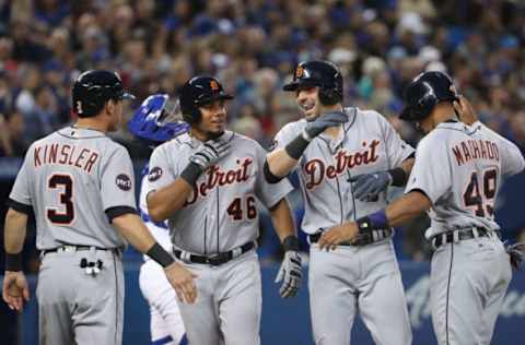 TORONTO, ON – SEPTEMBER 8: Nick Castellanos #9 of the Detroit Tigers is congratulated by Ian Kinsler #3 and Jeimer Candelario #46 and Dixon Machado #49 after hitting a grand slam home run in the third inning during MLB game action against the Toronto Blue Jays at Rogers Centre on September 8, 2017 in Toronto, Canada. (Photo by Tom Szczerbowski/Getty Images)