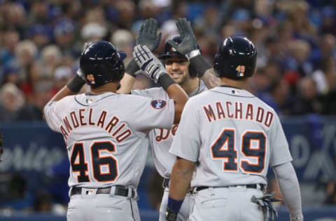 TORONTO, ON – SEPTEMBER 8: Nick Castellanos #9 of the Detroit Tigers is congratulated by Jeimer Candelario #46 and Dixon Machado #49 after hitting a grand slam home run in the third inning during MLB game action against the Toronto Blue Jays at Rogers Centre on September 8, 2017 in Toronto, Canada. (Photo by Tom Szczerbowski/Getty Images)