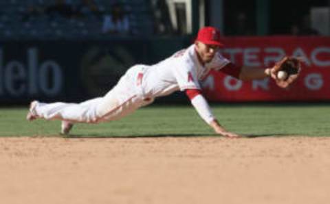 ANAHEIM, CA – SEPTEMBER 21: Shortstop Andrelton Simmons #2 of the Los Angeles Angels of Anaheim dives to catch a ball hit by Yan Gomes #7 of the Cleveland Indians to get the last out of the top of the ninth inning on September 21, 2017 at Angel Stadium of Anaheim in Anaheim, California. (Photo by Stephen Dunn/Getty Images)