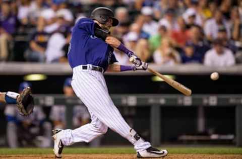 DENVER, CO – AUGUST 2: David Dahl #26 of the Colorado Rockies hits a sixth inning single against the Los Angeles Dodgers during a game at Coors Field on August 2, 2016 in Denver, Colorado. (Photo by Dustin Bradford/Getty Images)